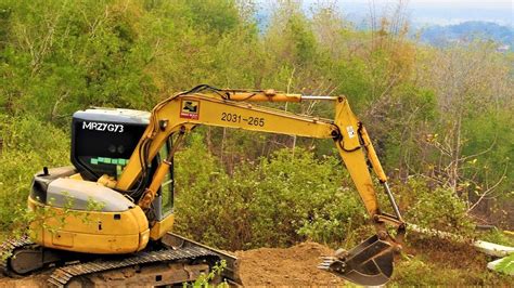 leveling a path with mini excavator|mini excavator land clearing.